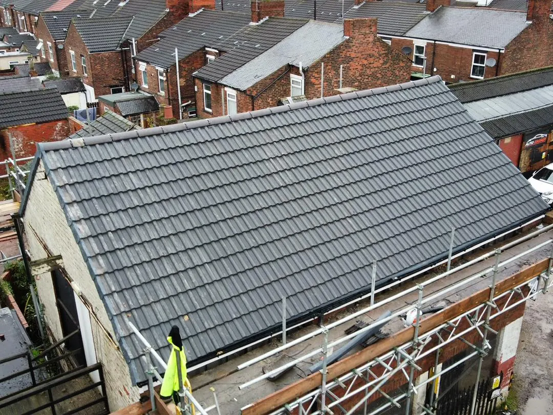 Grey concrete tile re roof on a semi detached house