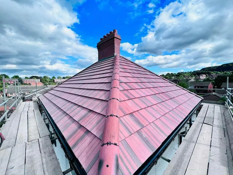 Red tiled roof with a new ridge line