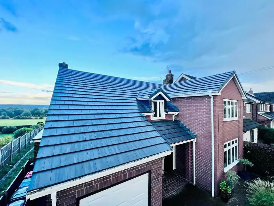Blue grey tiled roof on a detached house