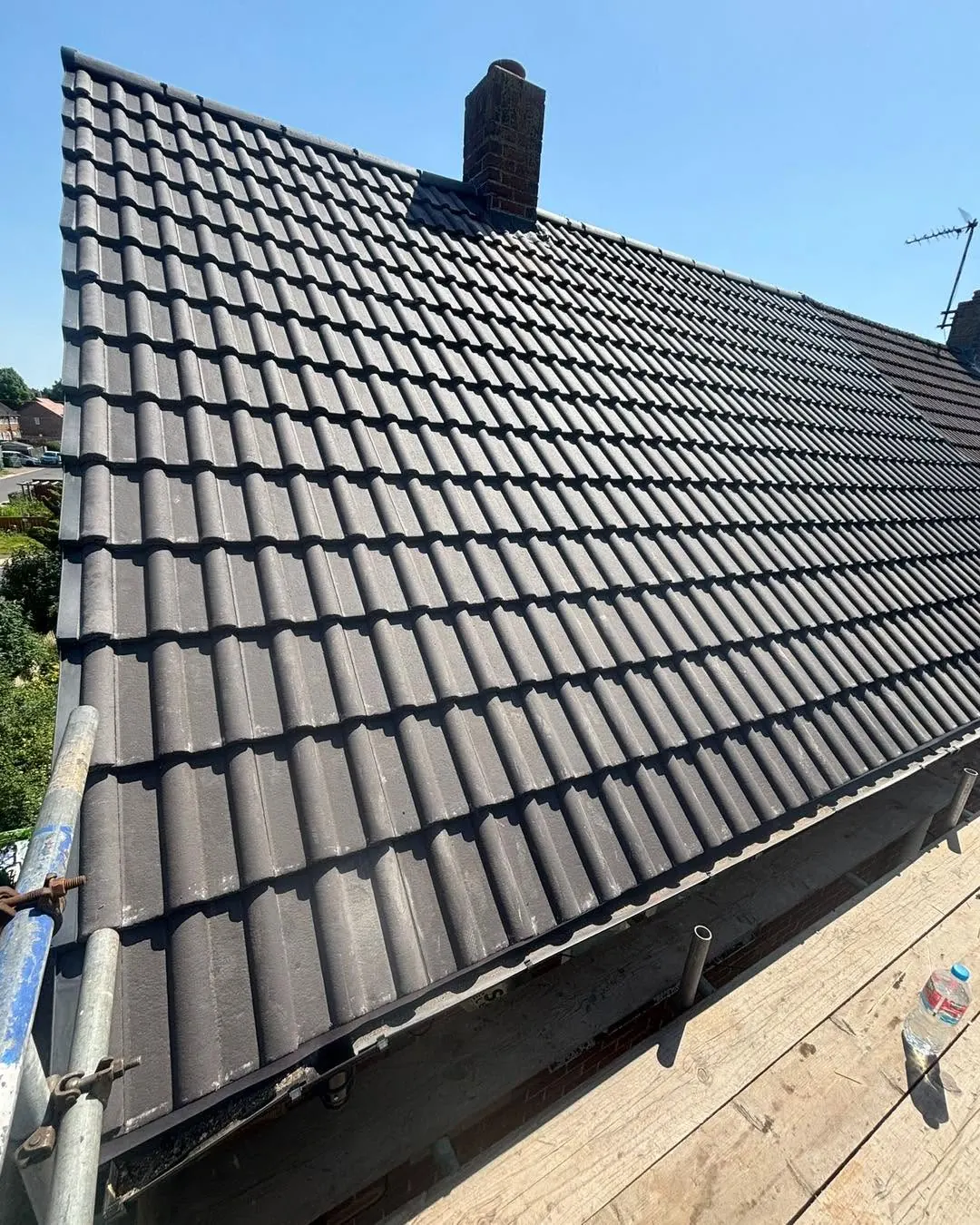Dark grey tiled roof slope