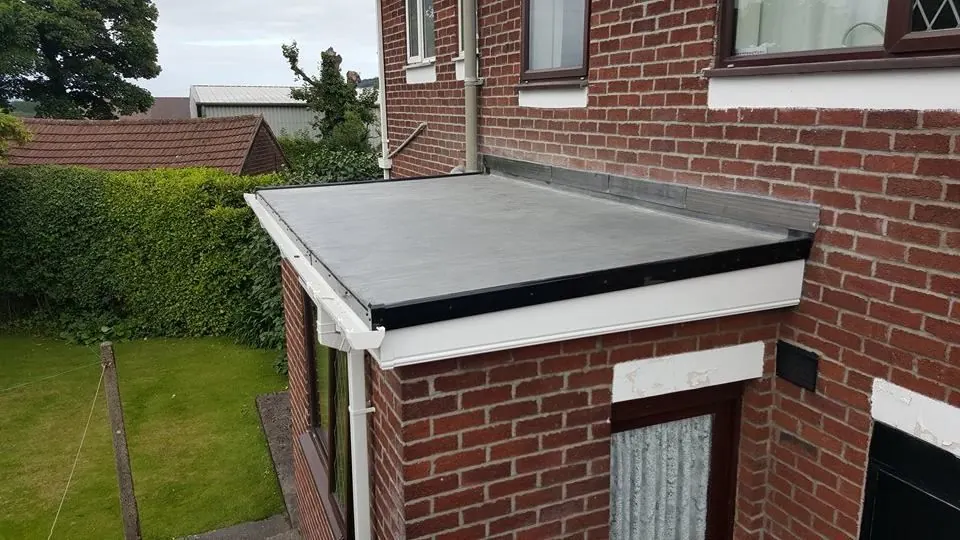 Flat roof over a porch and garage