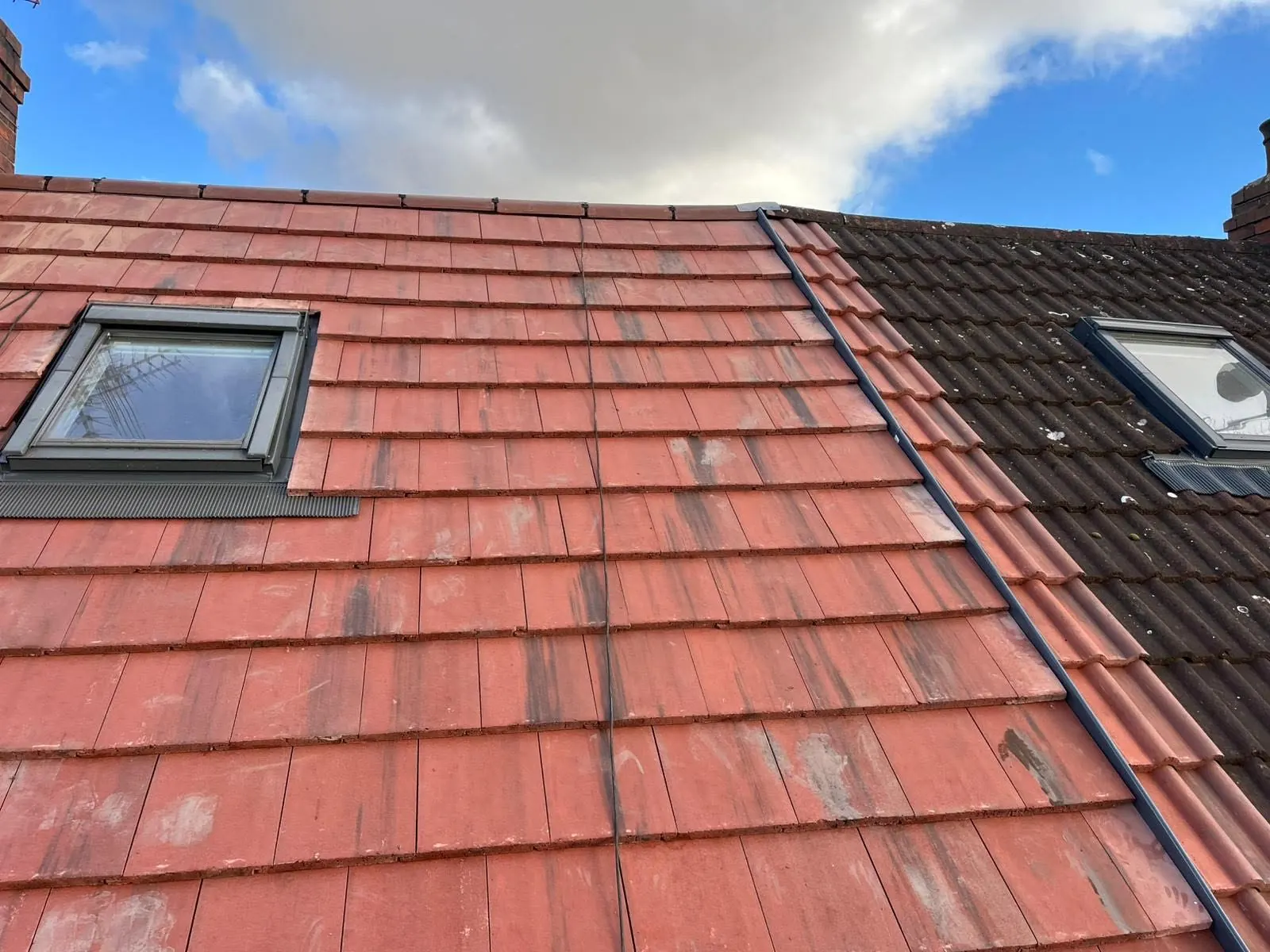 Roof window in a red tiled roof