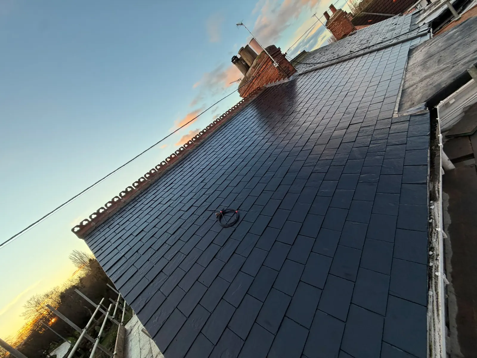New slate roof at sunset