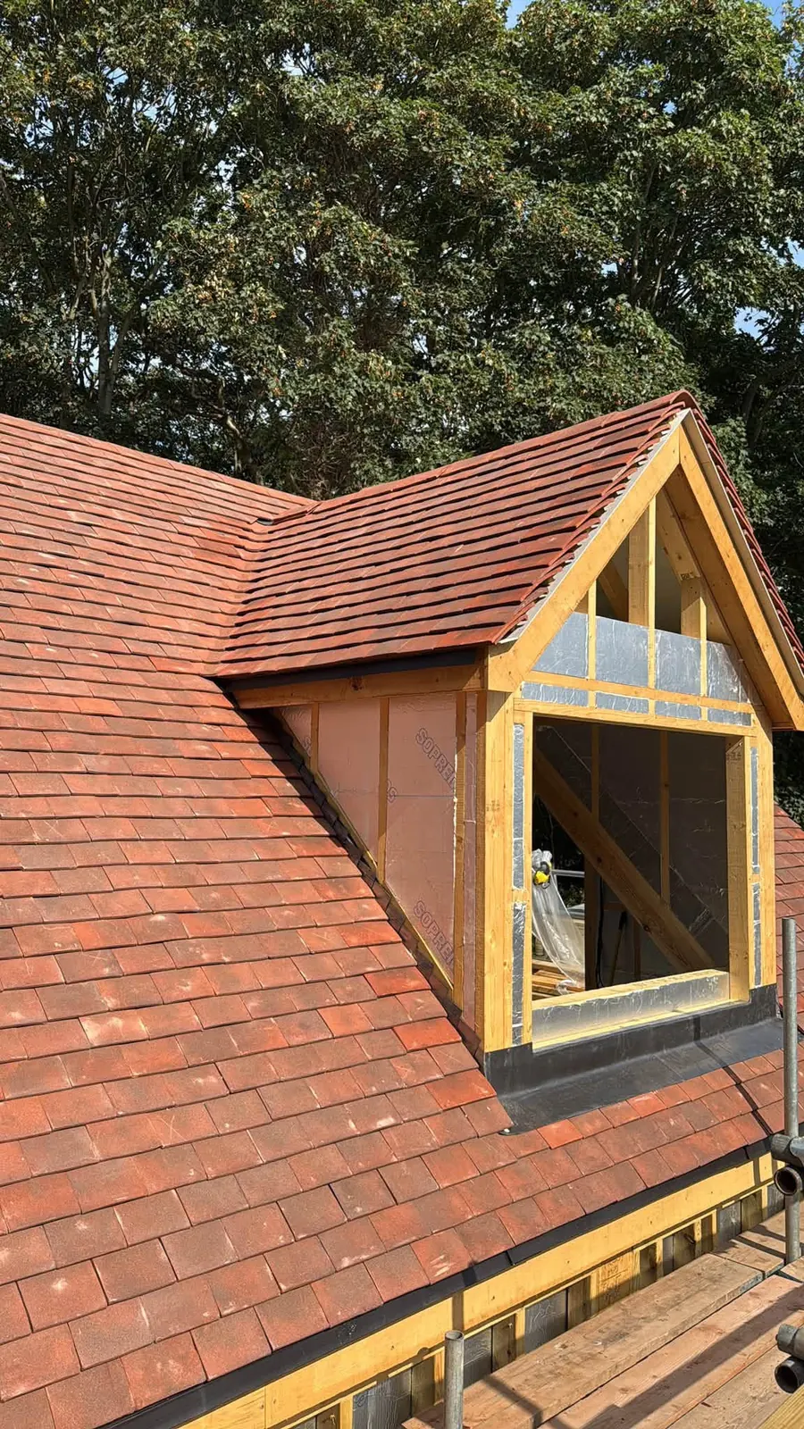 Red tiled dormer with timber cheeks