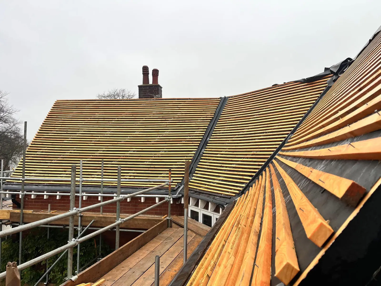 Roof stripped and battened ready for new tiles