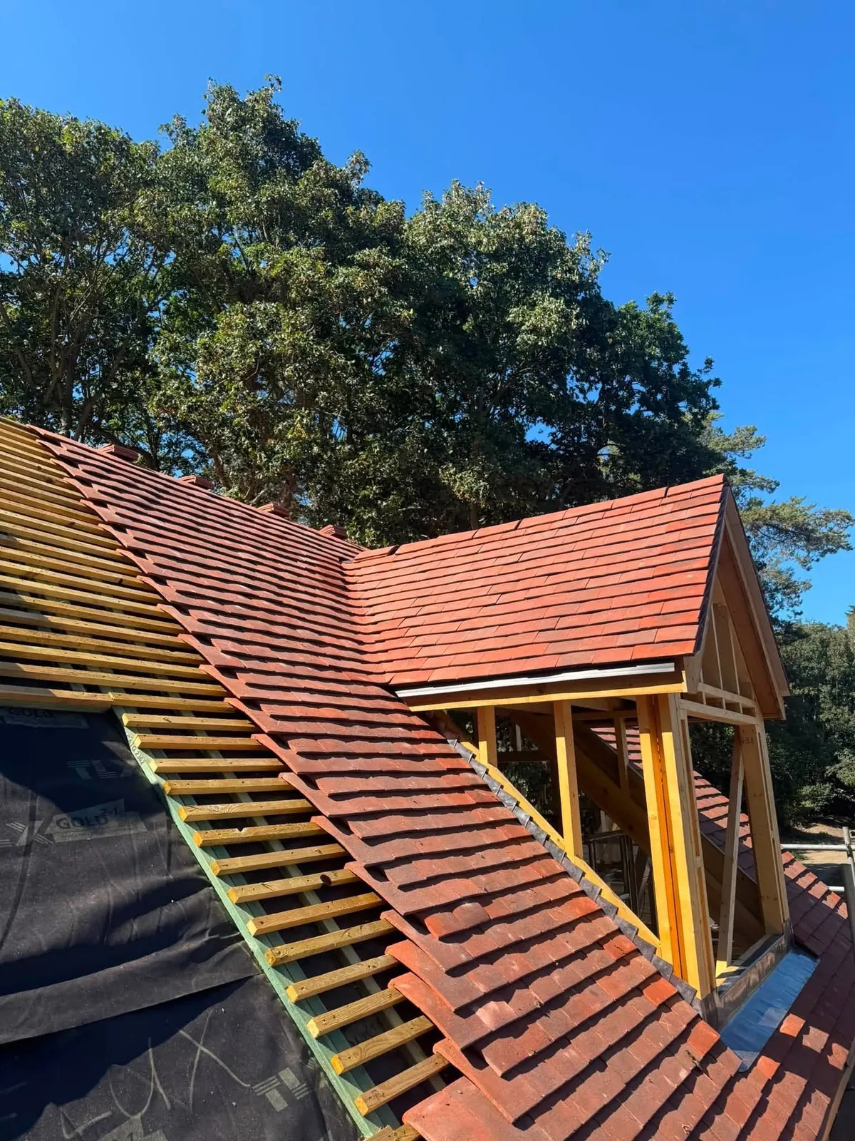 Dormer being tiled on new battens