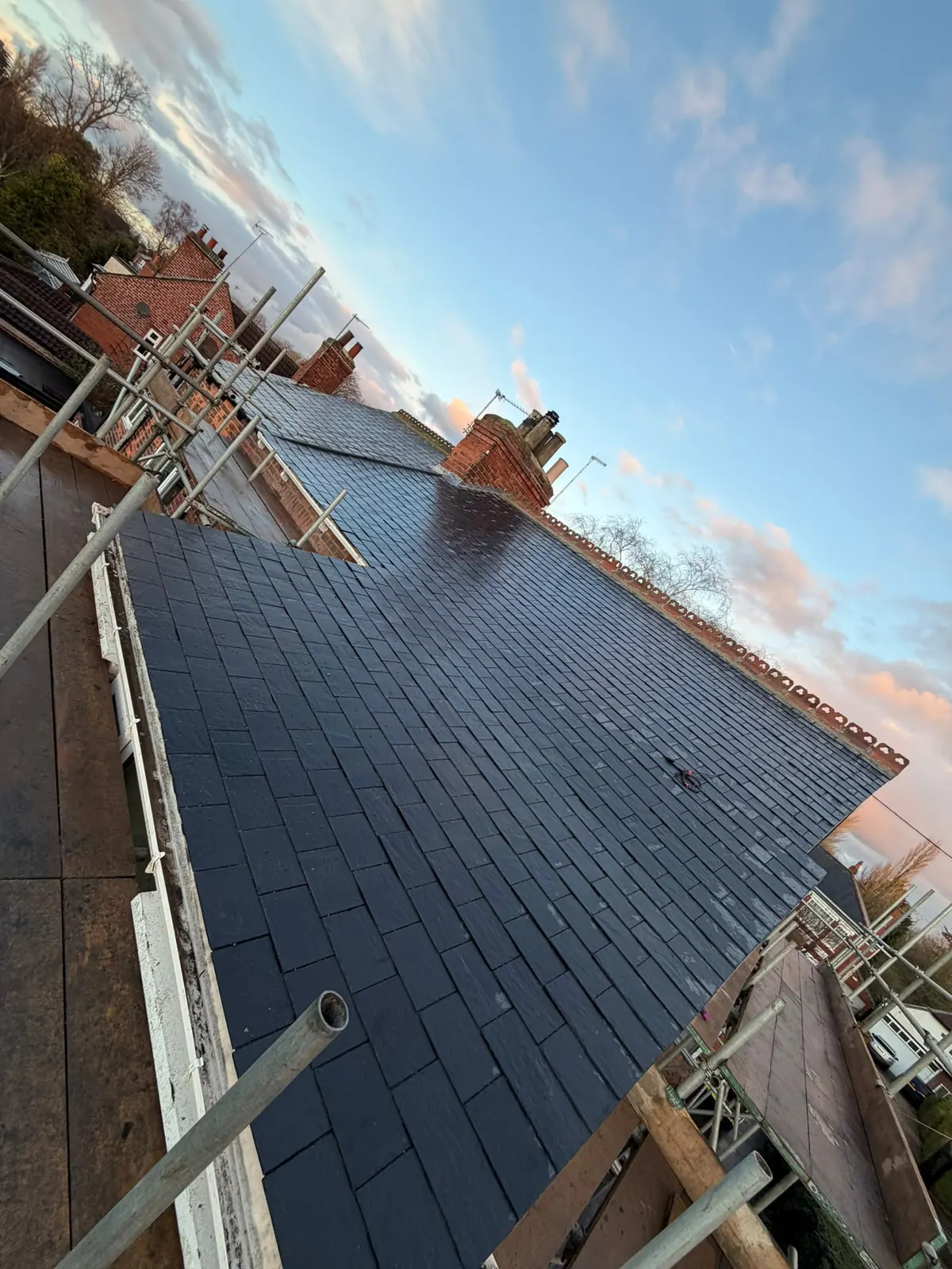 Slate roof under a blue sky