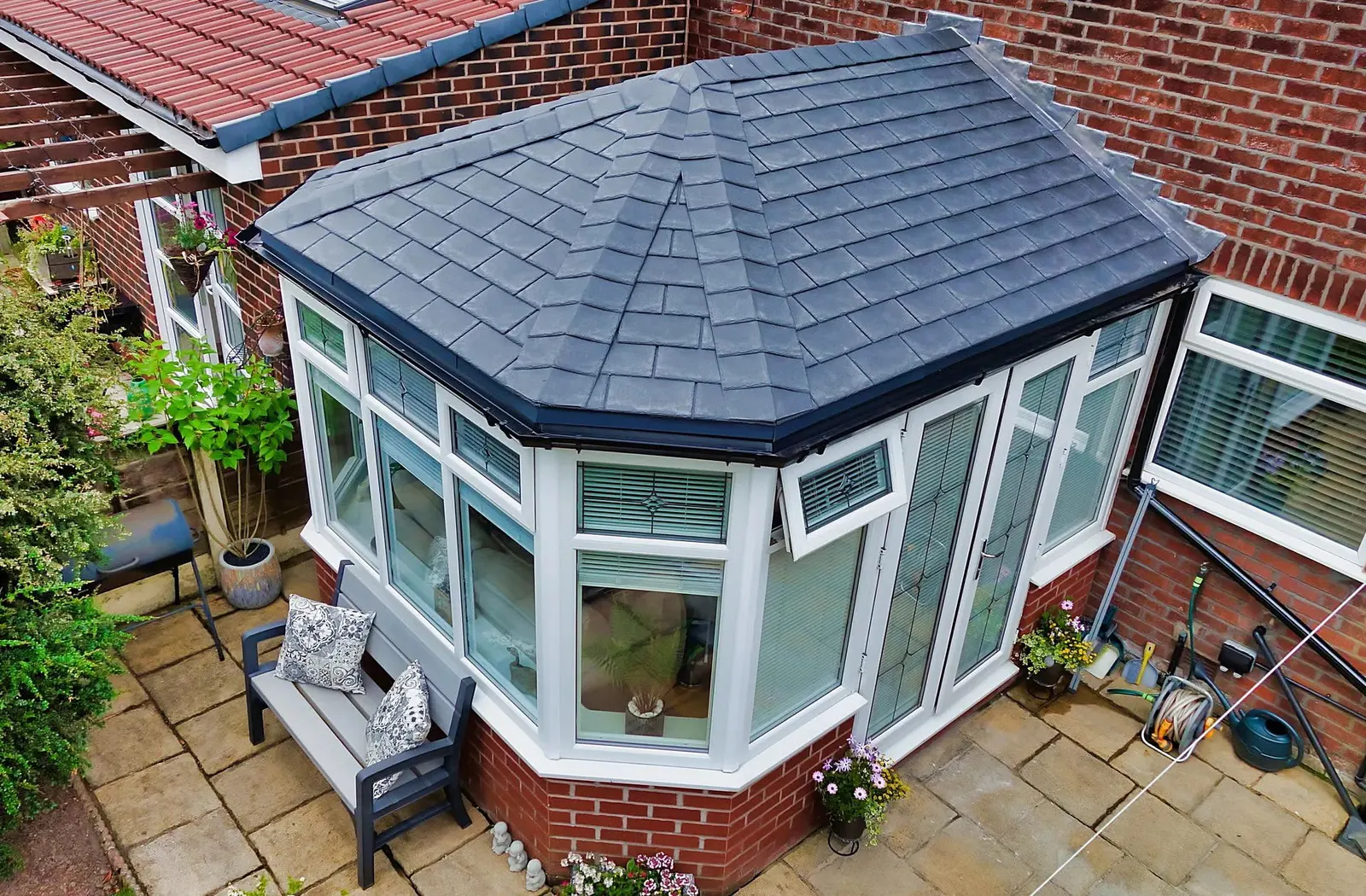 Conservatory with a new grey tiled roof seen from above