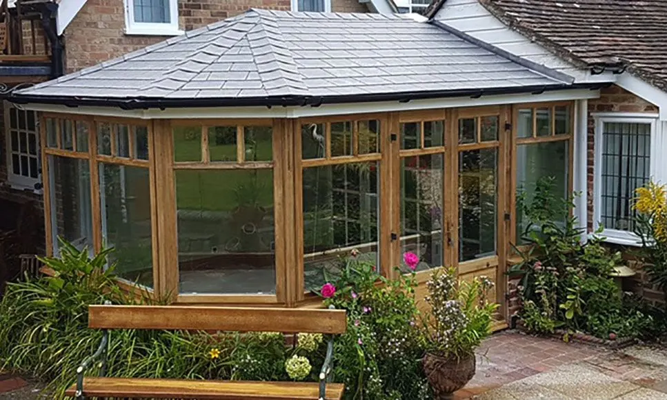 Oak framed conservatory with a new solid roof