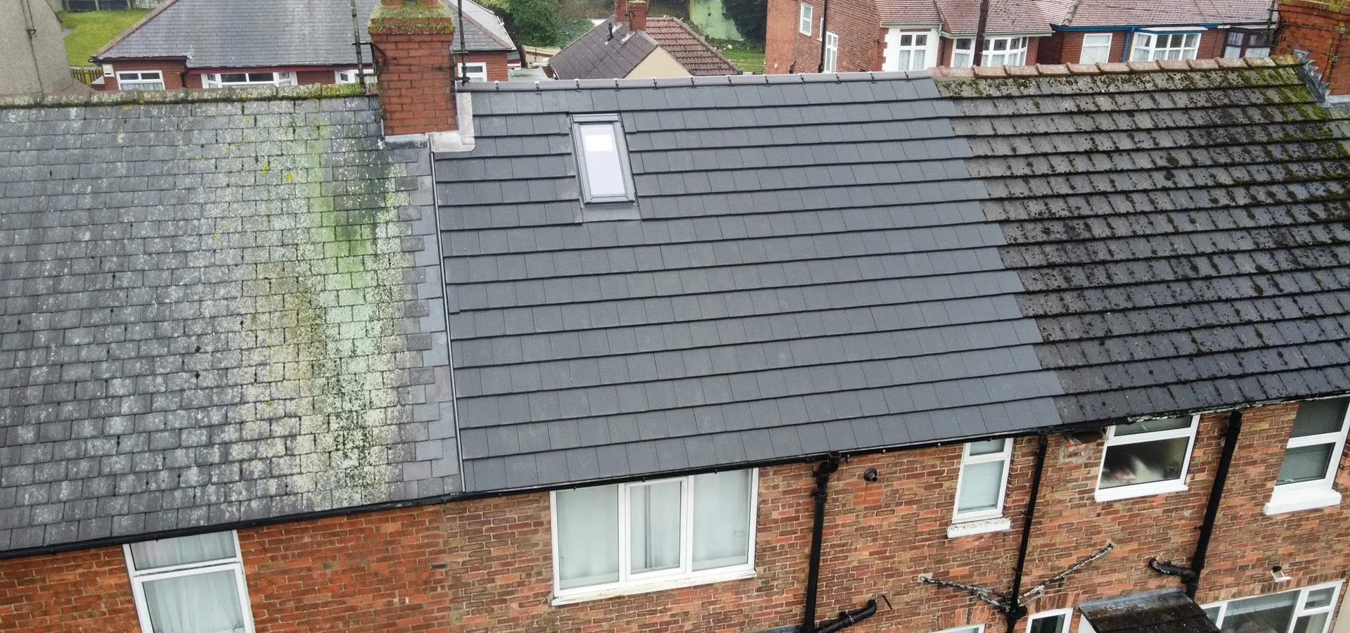 Drone view of a terraced roof part way through being re-tiled